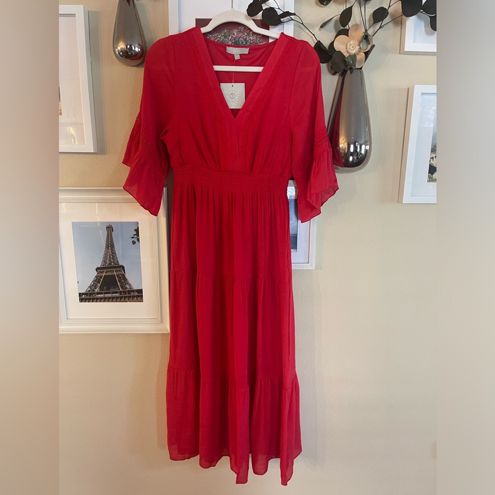 Vacation wear with this red tiered maxi dress! Boho style lace detail